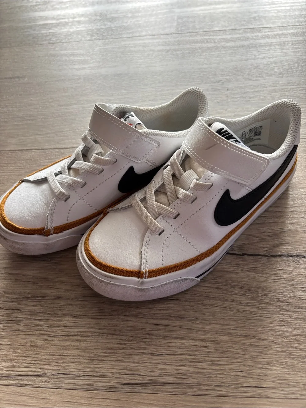 Nike Kids White Sneakers with Black Swoosh and Tan Trim